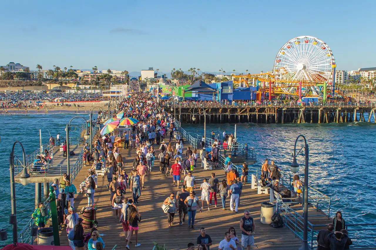 santa monica pier full of people enjoying themselves